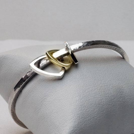 Tumbling triangle bangle